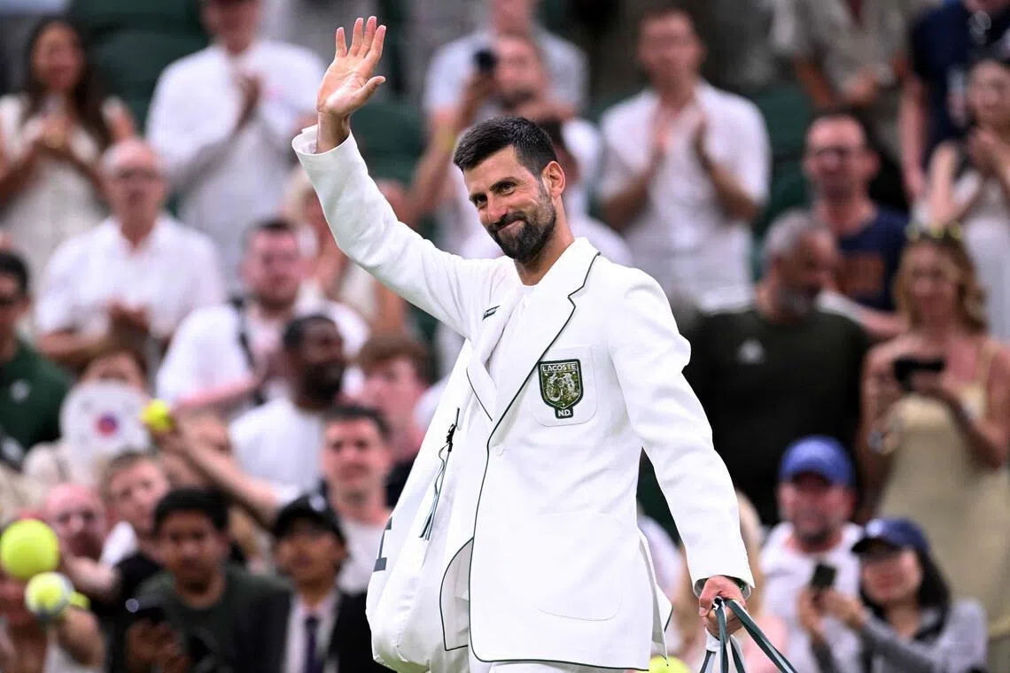 Serbia’s Novak Djokovic wearing a personalised cream jacket as he leaves the court after beating Greece’s Stefanos Tsitsipas at Wimbledon on July 1.