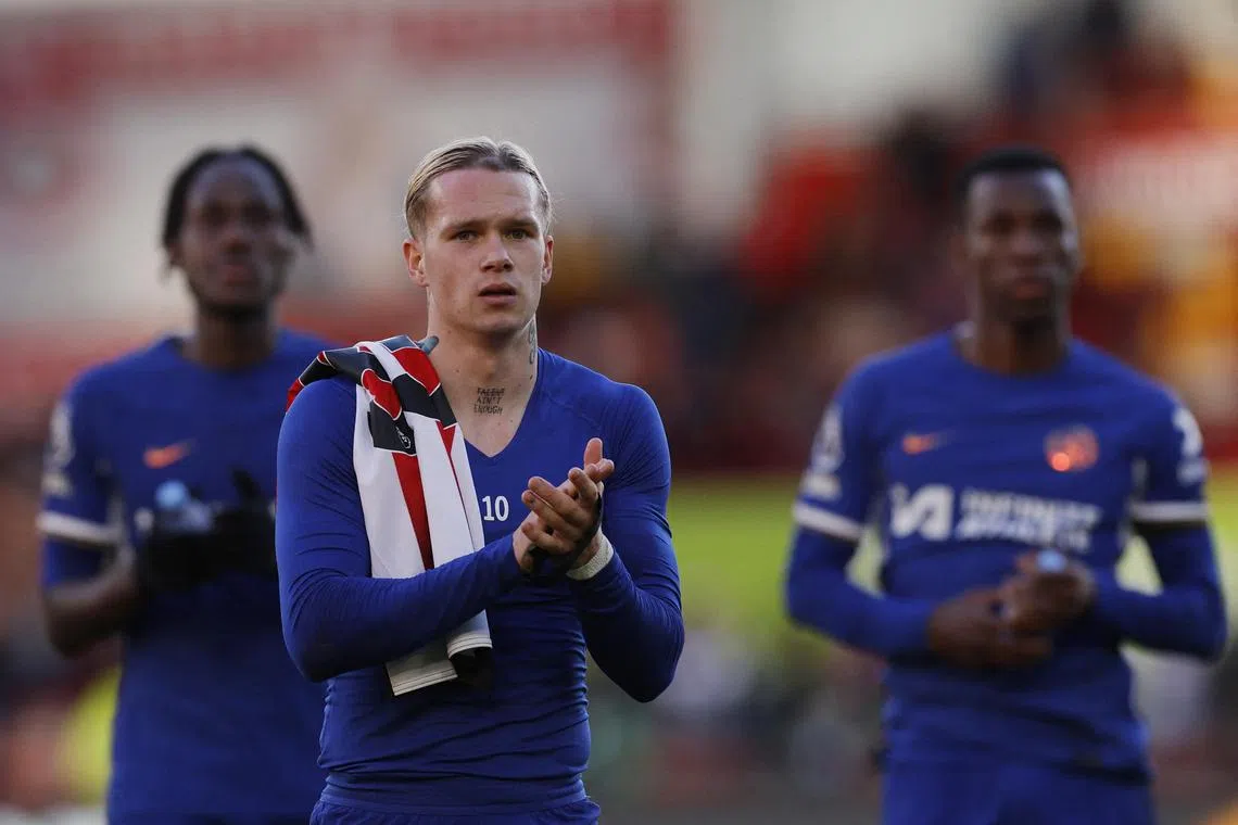 Chelsea's Mykhailo Mudryk applauds fans after the match.