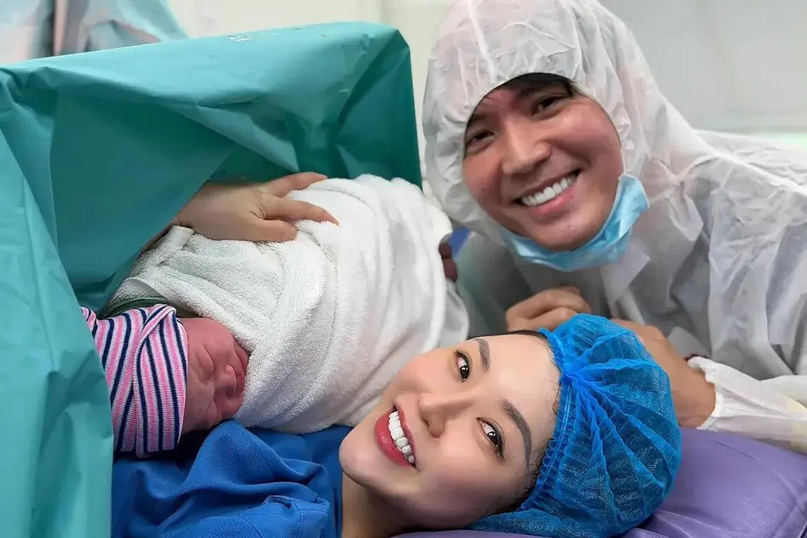 Singaporean actor Desmond Ng with his wife Kanny Theng and their newborn son Kai Kai.