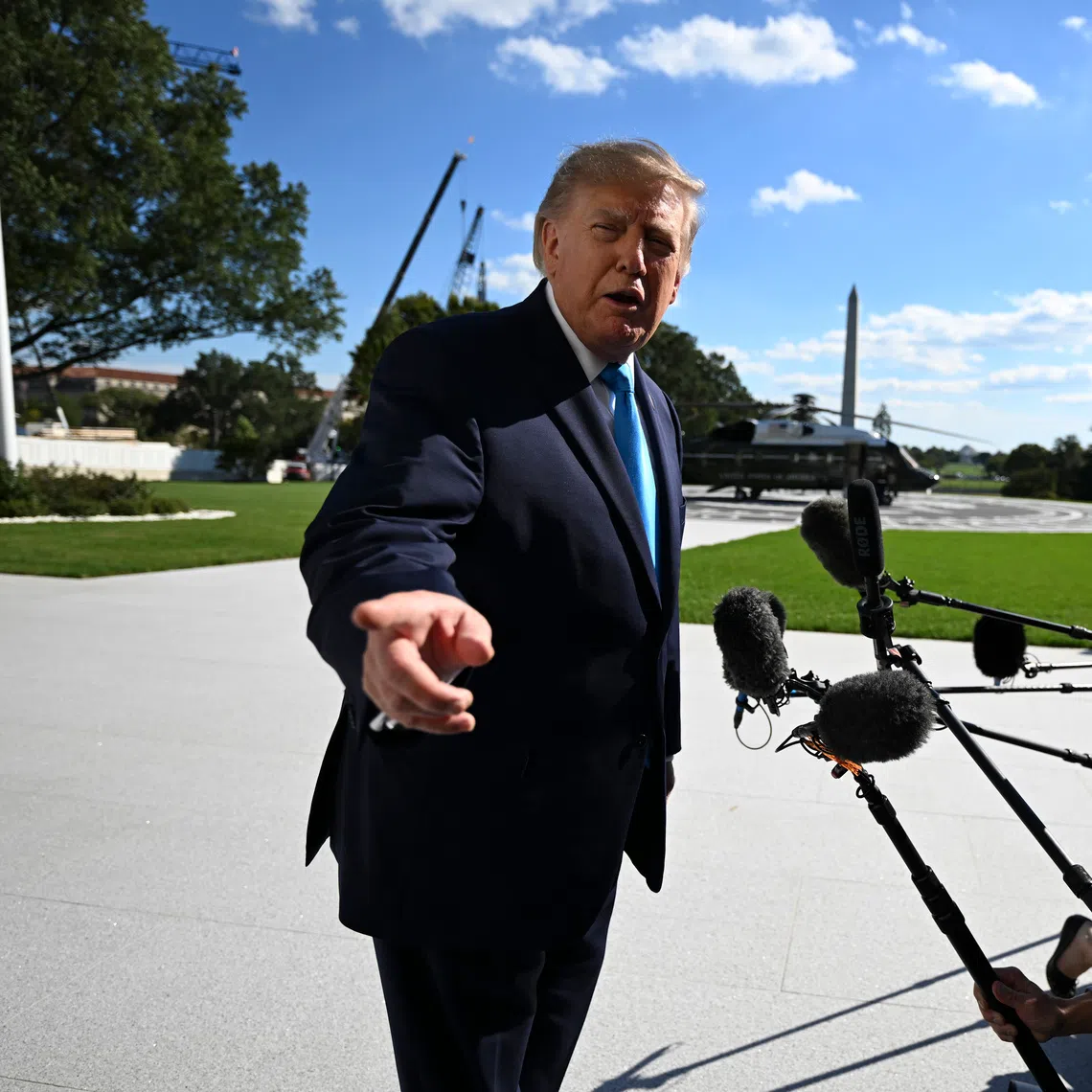 US President Donald Trump speaks to reporters outside the White House before boarding Marine One on the South Lawn in Washington, on Oct 5.