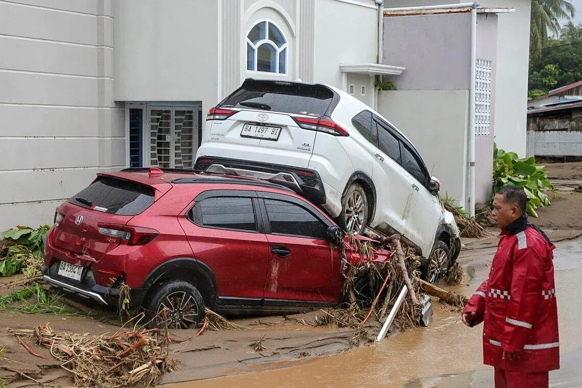 A man inspecting damages at a flood-affected area in Padang, West Sumatra, Indonesia, on Nov 27, 2025.The state administrative court received the lawsuit documents on May 7, the court’s website showed.
