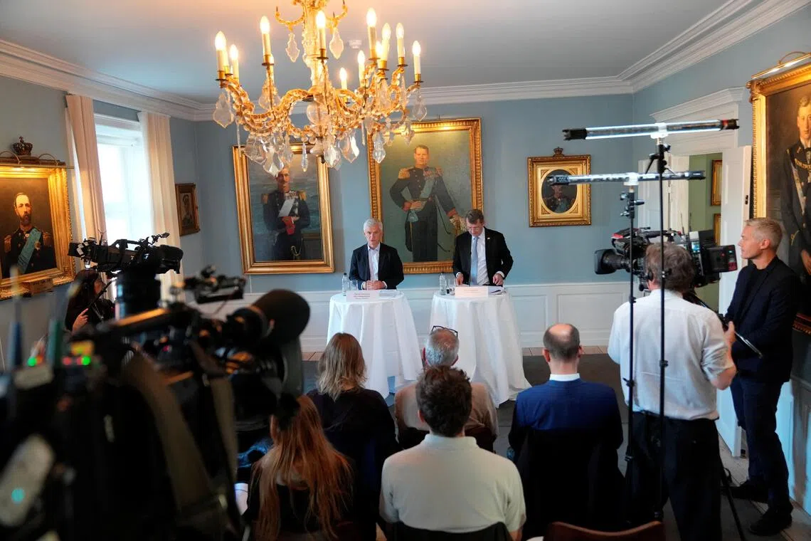 Danish Defence Intelligence Service  director Thomas Ahrenkiel (left) and Denmark Defence Minister Troels Lund Poulsen delivering a press conference in Copenhagen, on Oct 3.