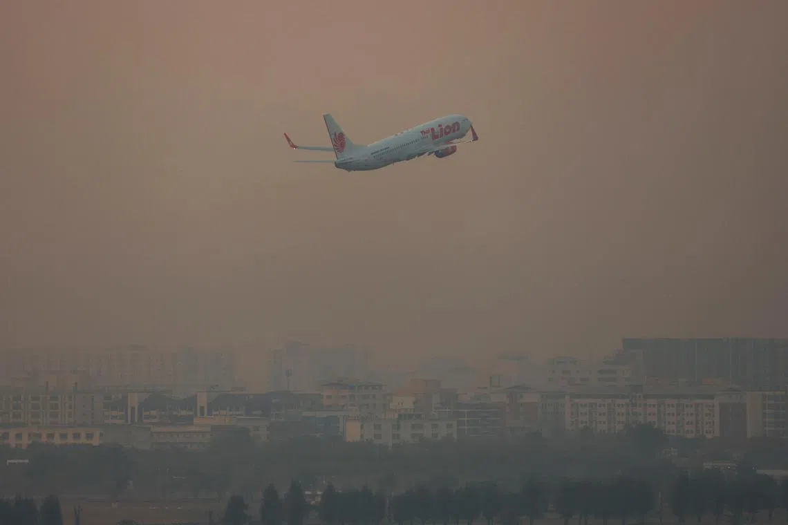 A plane flies amid air pollution, in Bangkok, Thailand on Jan 31.