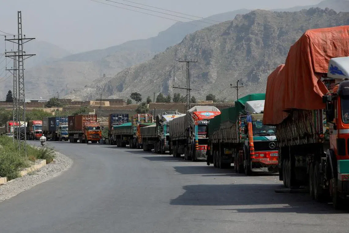 FILE PHOTO: Trucks loaded with supplies to leave for Afghanistan are seen stranded at the Michni checkpost, after the main Pakistan-Afghan border crossing closed after clashes, in Torkham, Pakistan September 7, 2023. REUTERS/Fayaz Aziz/File Photo