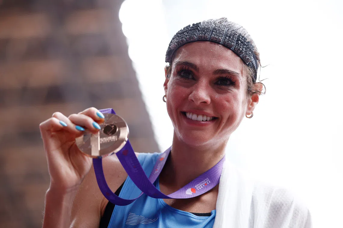 World Athletics Championships Tokyo 2025 - Women's Marathon Final - Japan National Stadium, Tokyo, Japan - September 14, 2025 Bronze medallist Uruguay's Julia Paternain poses with her medal after finishing third in the Women's Marathon Final REUTERS/Sarah Meyssonnier