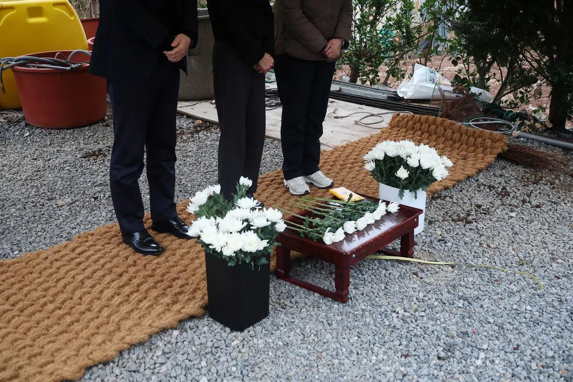 Family members of village leader Kwon and his wife, who were killed in the fire while travelling back to their village to rescue other people during a wildfire, mourn at Kwon's house in Yeongyang, South Korea, March 28, 2025. REUTERS/Kim Hong-Ji