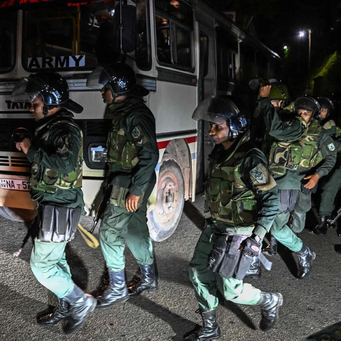 Sri Lankan army personnel arriving amid a riot at Mahara Prison complex on the outskirts of Colombo on Aug 1.