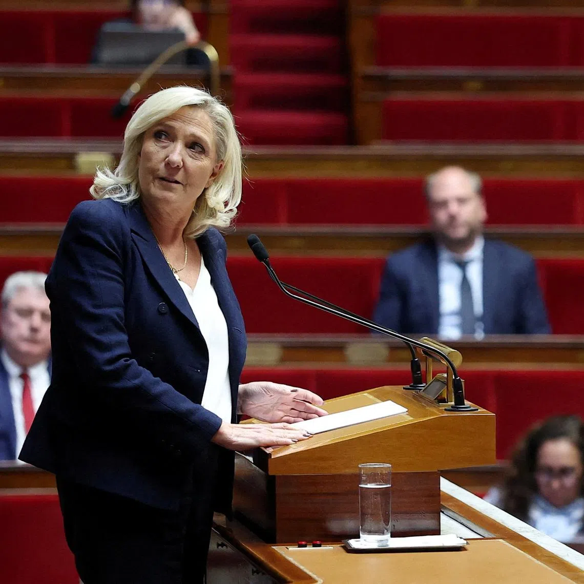 FILE PHOTO: French far-right leader and member of parliament Marine Le Pen, President of the French far-right National Rally (Rassemblement National - RN) party parliamentary group, delivers a speech during a debate on the situation in the Middle East at the National Assembly in Paris, France, March 25, 2026. REUTERS/Gonzalo Fuentes/File Photo