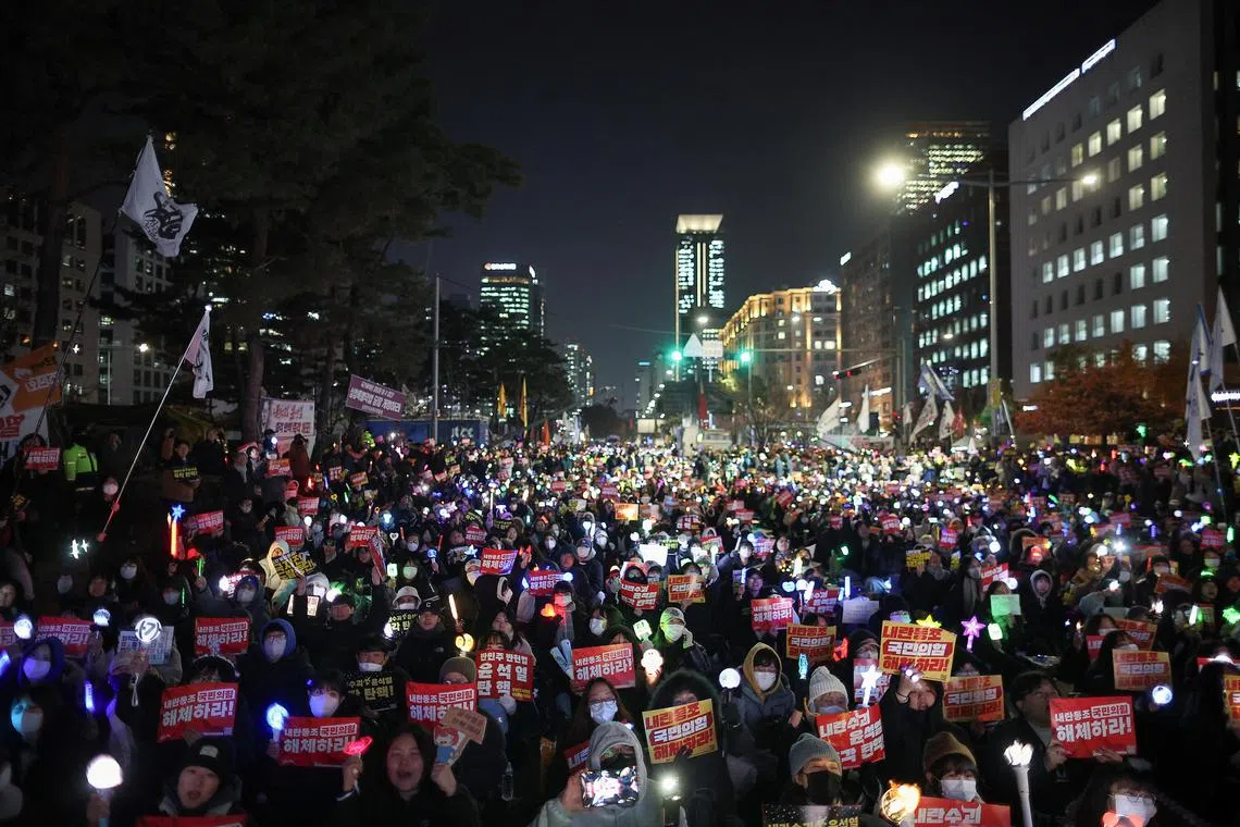 Protesters attend a rally in Seoul calling for the impeachment of South Korean President Yoon Suk Yeol on Dec 11.
