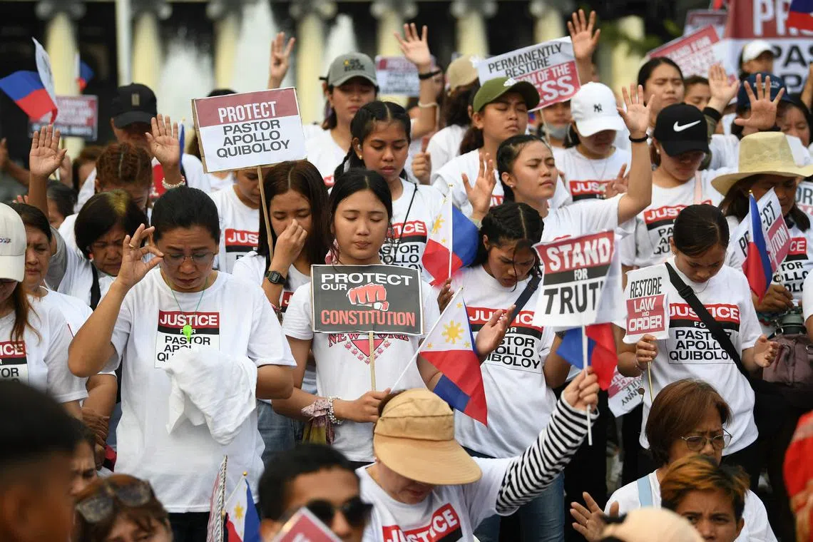 Supporters of cult leader Apollo Quiboloy hold a rally at a park in the Philippine capital Manila.
