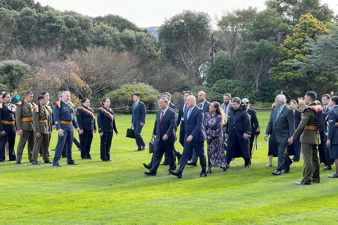 New Zealand Prime Minister Christopher Luxon and Governor General Cindy Kiro welcome Chinese Premier Li Qiang with a traditional Maori welcome and honour guard, during Li Qiang's visit to New Zealand, on the grounds of the official residence of the Governor-General, in Wellington, New Zealand June 13, 2024. REUTERS/Lucy Craymer