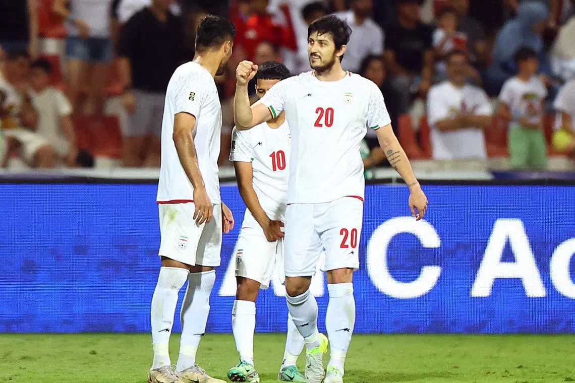 Soccer Football - World Cup - Asian Qualifiers - Third Round - Group A - Iran v Qatar - Al-Rashid Stadium, Dubai, United Arab Emirates - October 15, 2024  Iran's Sardar Azmoun celebrates scoring their second goal with teammates REUTERS/Rula Rouhana
