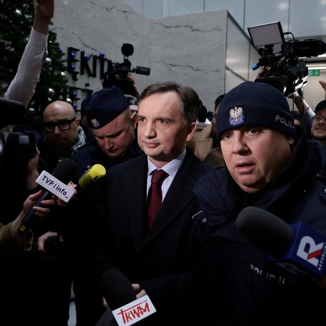 Former Polish justice minister Zbigniew Ziobro is surrounded by members of the media after he was detained by police at the Polish TV Republika station's headquarters on Jan 31. 2025.
