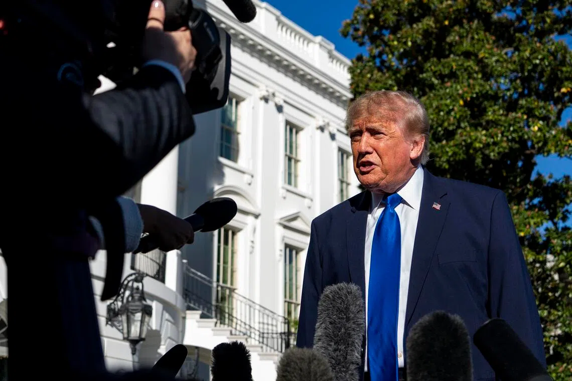 US President Donald Trump speaking to the press before departing from the South Lawn of the White House on Oct 22 for a rally in Sioux City, Iowa.