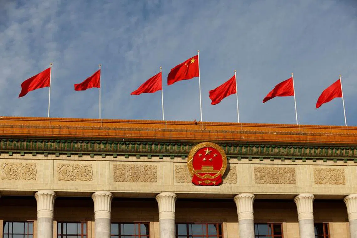 A Chinese flag flutters on top of the Great Hall of the People ahead of the opening ceremony of the Belt and Road Forum (BRF), to mark 10th anniversary of the Belt and Road Initiative, in Beijing, China October 18, 2023. REUTERS/Edgar Su/File Photo