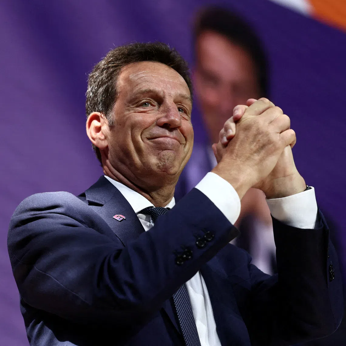 FILE PHOTO: Outgoing French employers body MEDEF union leader Geoffroy Roux de Bezieux reacts as he delivers a speech during a meeting to elect a new leader of the French business organisation MEDEF, in Meudon, near Paris, France, July 6, 2023. REUTERS/Stephanie Lecocq/File Photo