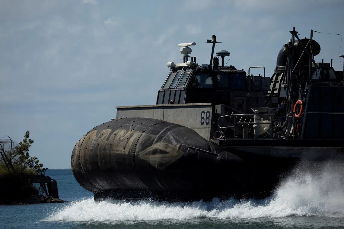 A U.S. Navy Landing Craft Air Cushion (LCAC) approaching the beach as gear and personnel are moved ashore in Ponce, Puerto Rico, on Dec 3, 2025. 
