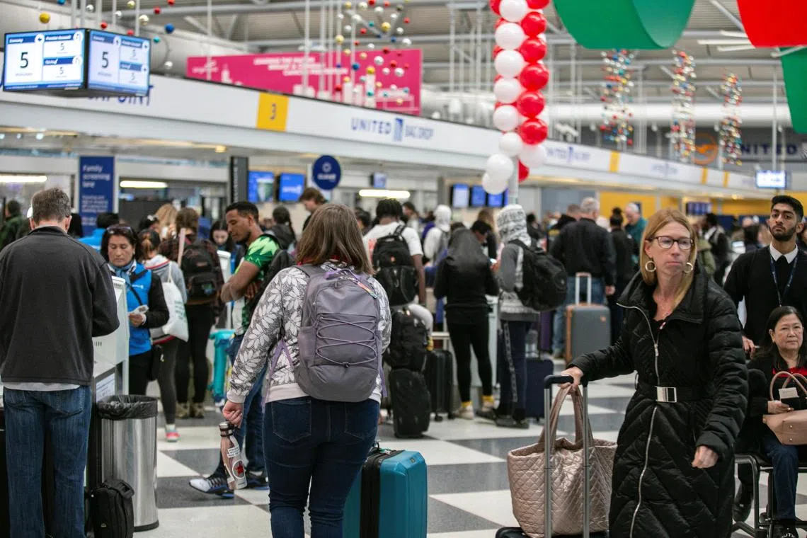 Passengers wait for the resumption of flights at O’Hare International Airport, in Chicago, Illinois, on Jan 11, 2023.