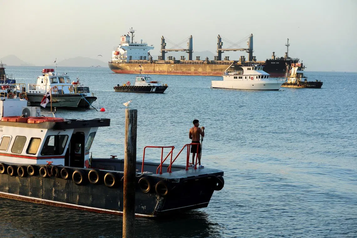 FILE PHOTO: A cargo ship sails towards the Bridge of the Americas, which spans the entrance to the Panama Canal, after newly sworn-in U.S. President Donald Trump's remarks during his inauguration speech, when he vowed that the United States would take back the canal, in Panama City, Panama January 22, 2025. REUTERS/Aris Martinez/File Photo