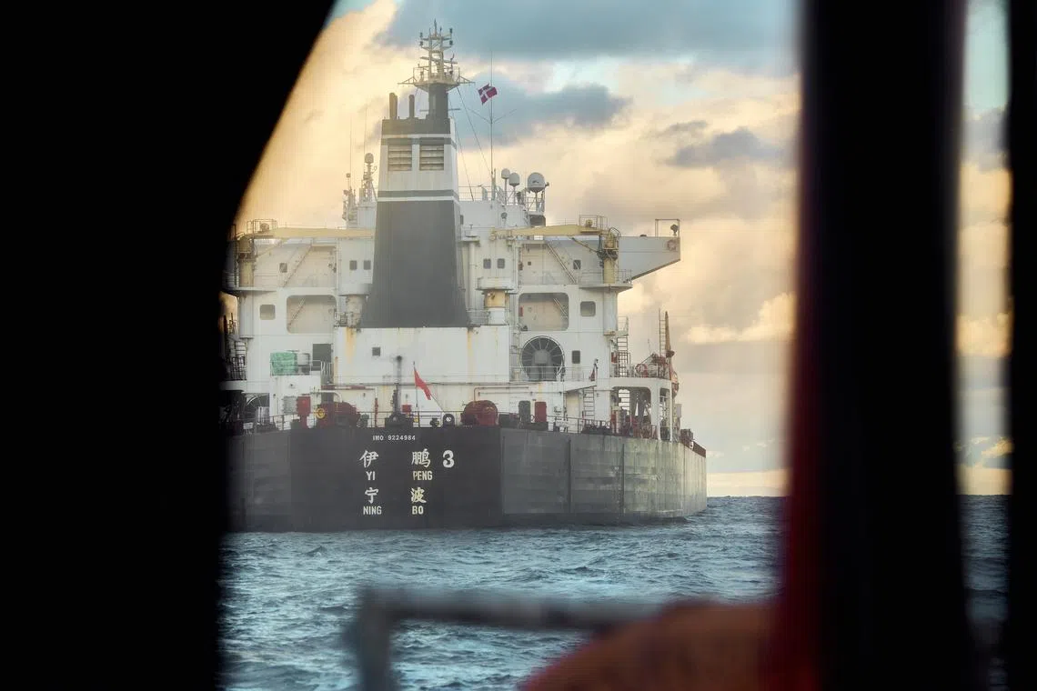 The Chinese bulk carrier Yi Peng 3 anchored and under surveillance by a Danish naval patrol vessel near the town of Grenaa in Denmark on Nov 20.