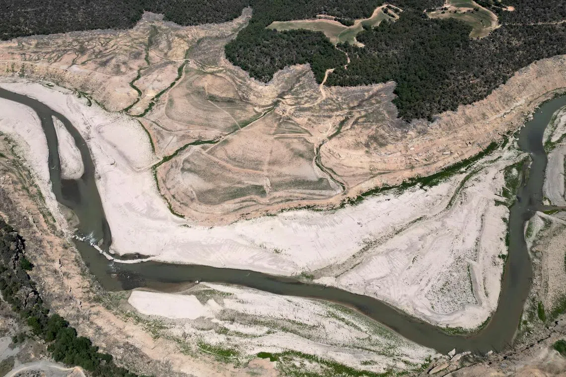FILE PHOTO: A view shows the ground of the Rialb reservoir as drinking water supplies have plunged to their lowest level since 1990 due to extreme drought, in the village of Bassella, Spain May 6, 2023. REUTERS/Nacho Doce/File Photo