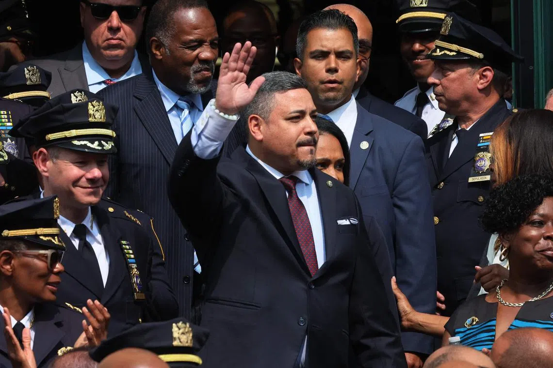 (FILES) First Deputy Commissioner Edward A. Caban waves as he arrives for a press conference at the NYPD 40th Precinct, where New York City Mayor Eric Adams is set to announce Caban as the new NYPD Commissioner, on July 17, 2023 in New York City. Caban, head of the largest police department in the United States, is set to resign amid a probe swirling through the city's top leadership, according to multiple US media reports on September 12, 2024. (Photo by Michael M. Santiago / GETTY IMAGES NORTH AMERICA / AFP)