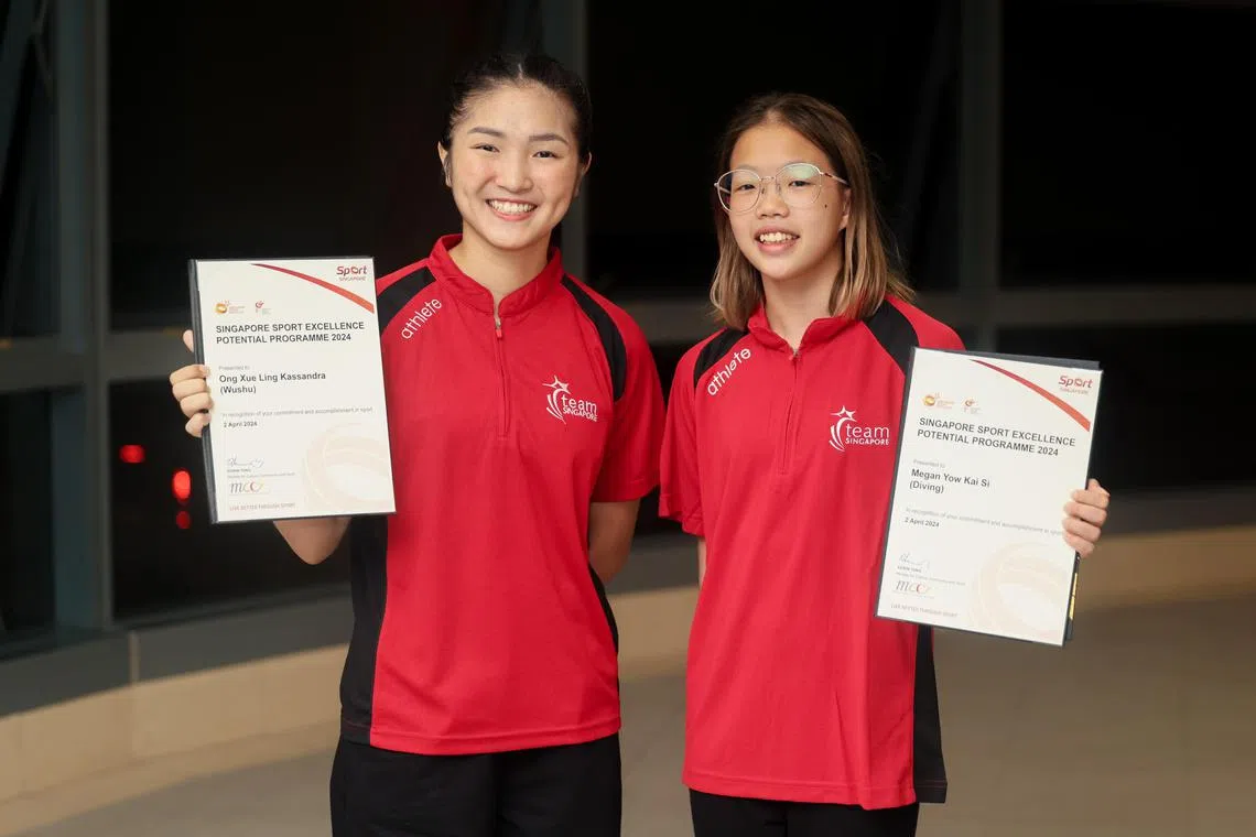 Diver Megan Yow (right), pictured with wushu exponent Kassandra Ong at the spexPotential programme ceremony, has withdrawn from the World Aquatics Championships.