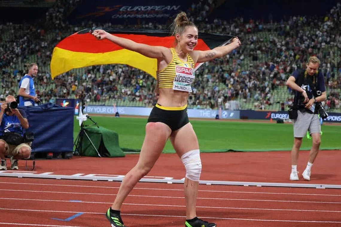 Athletics - 2022 European Championships - Olympiastadion, Munich, Germany - August 16, 2022 Germany's Gina Luckenkemper celebrates after winning gold in the women's 100m final REUTERS/Wolfgang Rattay