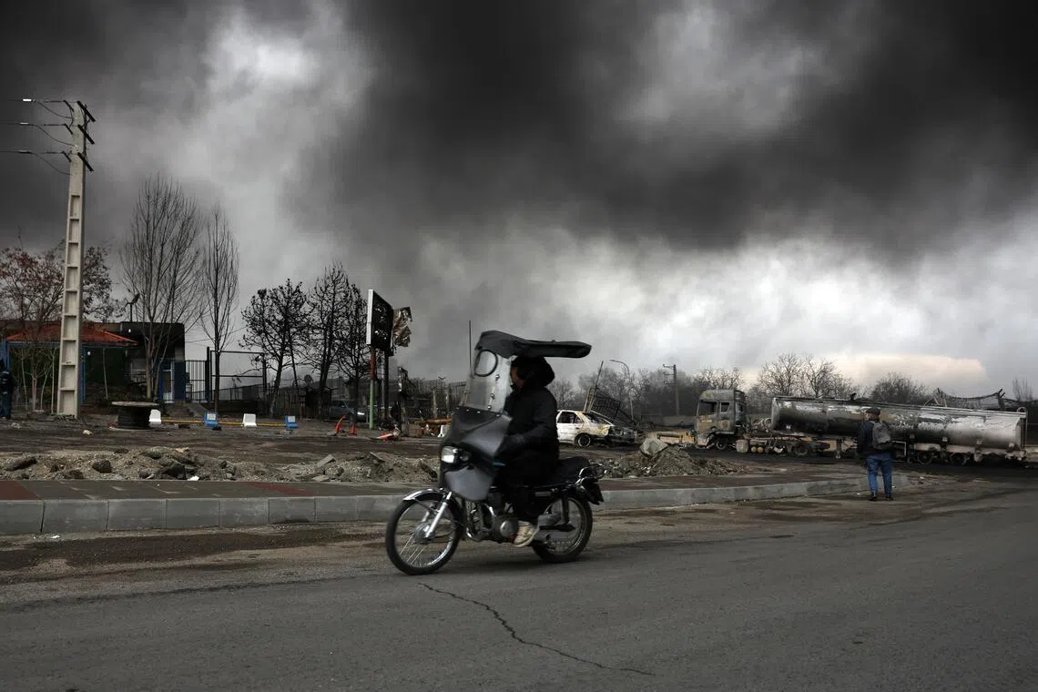With the sun blotted out, disoriented people in the Iranian capital had to turn on their lights to see through the gloom. 