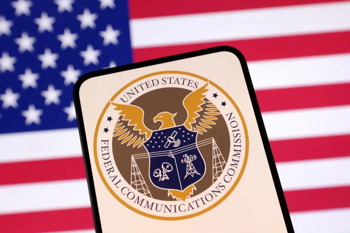 United States Federal Communications Commission logo and U.S. flag are seen in this illustration taken April 23, 2025. REUTERS/Dado Ruvic/Illustration