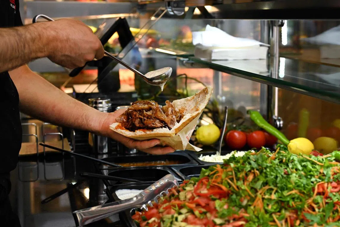The doner, made with thinly sliced meat cooked on a vertical rotisserie, has its origins in Turkey but is also beloved in Germany after being introduced there by Turkish migrants.