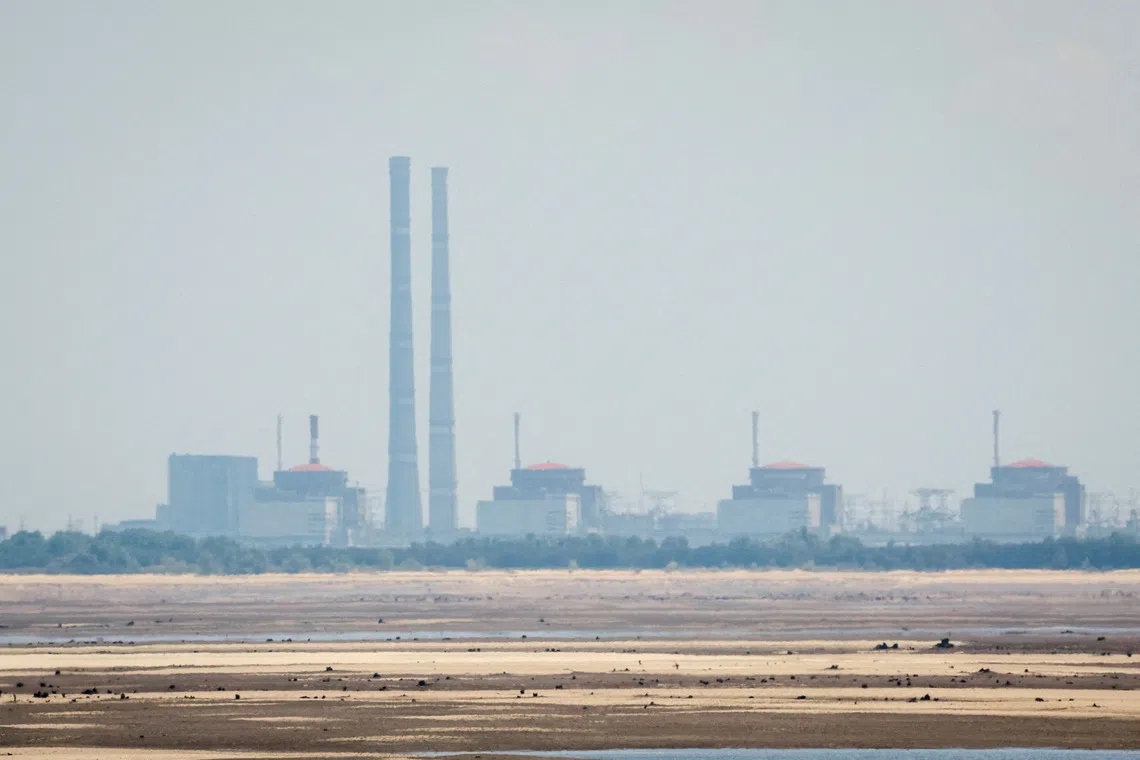 FILE PHOTO: A view shows Zaporizhzhia Nuclear Power Plant from the bank of Kakhovka Reservoir near the town of Nikopol after the Nova Kakhovka dam breached, amid Russia's attack on Ukraine, in Dnipropetrovsk region, Ukraine June 16, 2023. REUTERS/Alina Smutko/File Photo