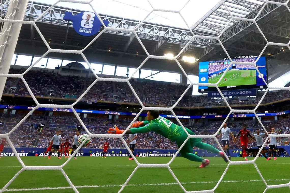 Soccer Football - FIFA World Cup 2026 - Group H -  Uruguay v Cape Verde - Miami Stadium, Miami Gardens, Florida, U.S. - June 21, 2026 Cape Verde's Kevin Pina scores their first goal past Uruguay's Fernando Muslera REUTERS/Amanda Perobelli
