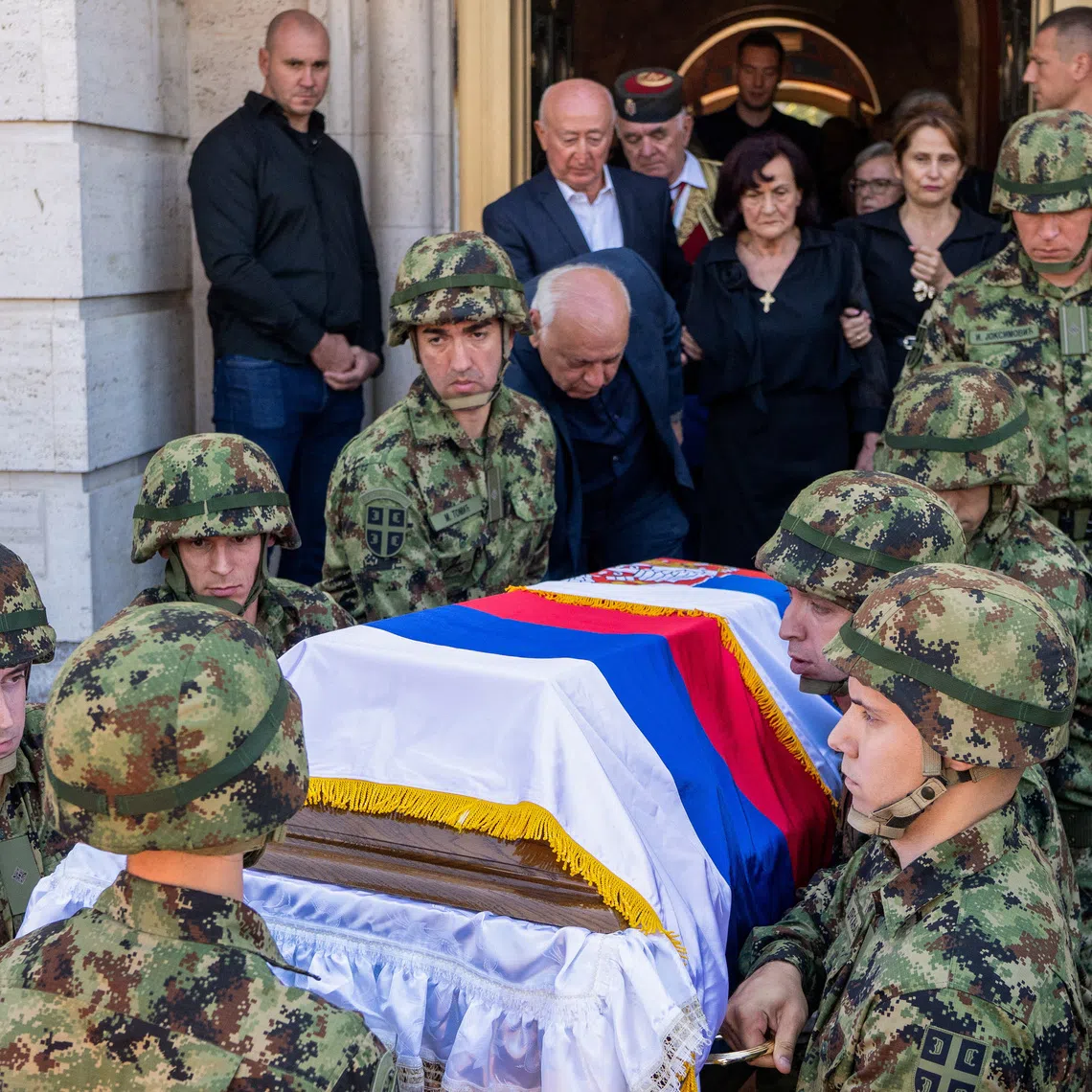 Serbian army soldiers carry the coffin of former Bosnian Serb wartime general Ratko Mladic outside the Church of St. Luke before burial, in Belgrade, Serbia, September 7, 2026. REUTERS/Uros Arsic