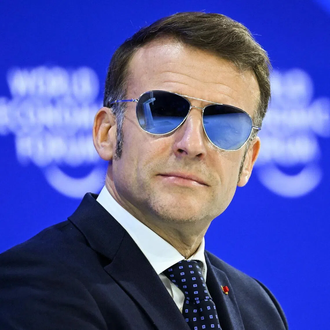 French President Emmanuel Macron wore sunglasses at the World Economic Forum in Davos, Switzerland, due to a burst blood vessel.