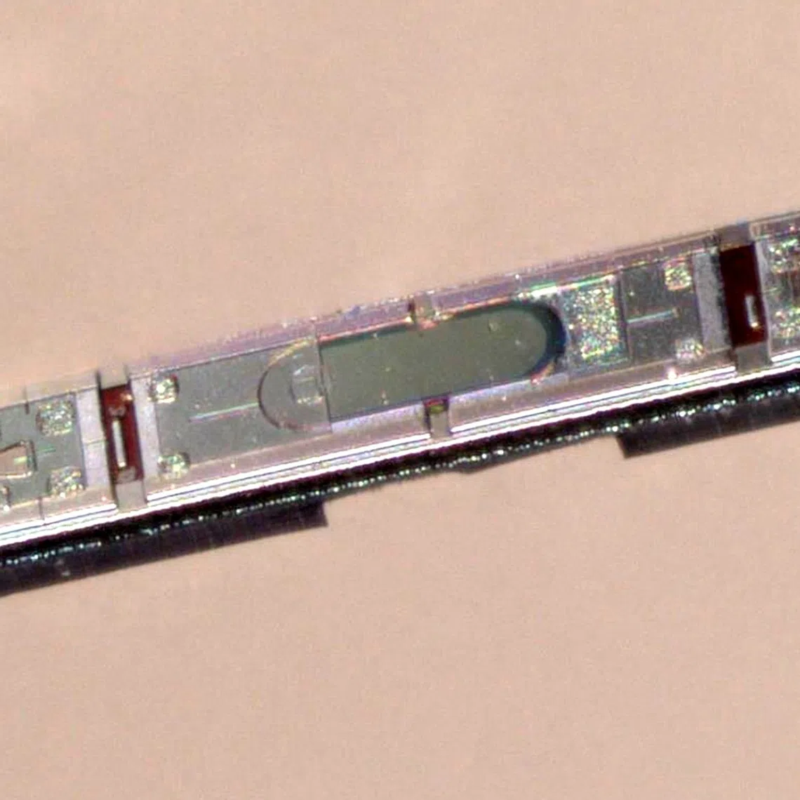 The microscale optoelectronic tetherless electrode (MOTE) is a wireless neural implant measuring about 300 microns in length and 70 microns in width.
