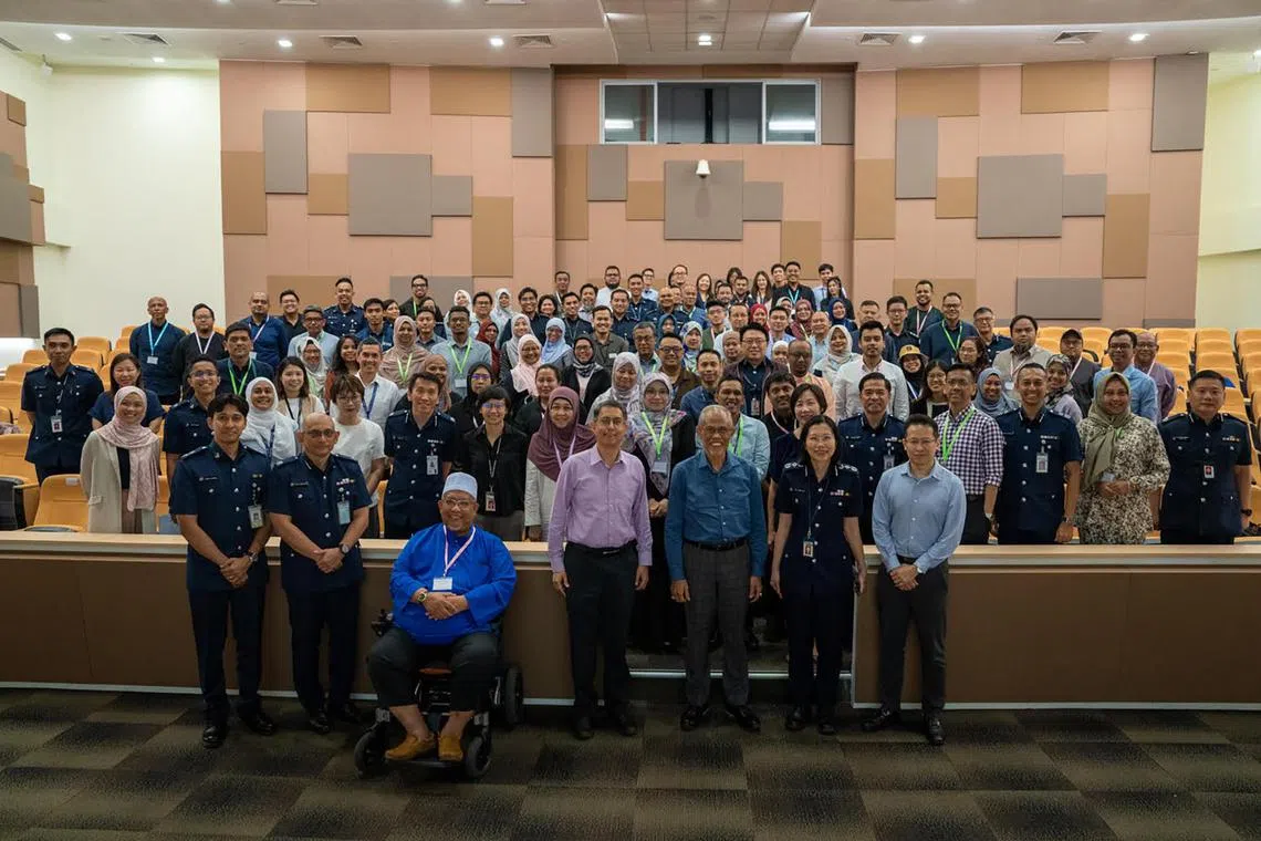 Minister for Social and Family Development Masagos Zulkifli (front row, centre right), Minister of State for Home Affairs Muhammad Faishal Ibrahim (front row, centre left) and other attendees at the MMO Rehabilitation Network Forum 2023.