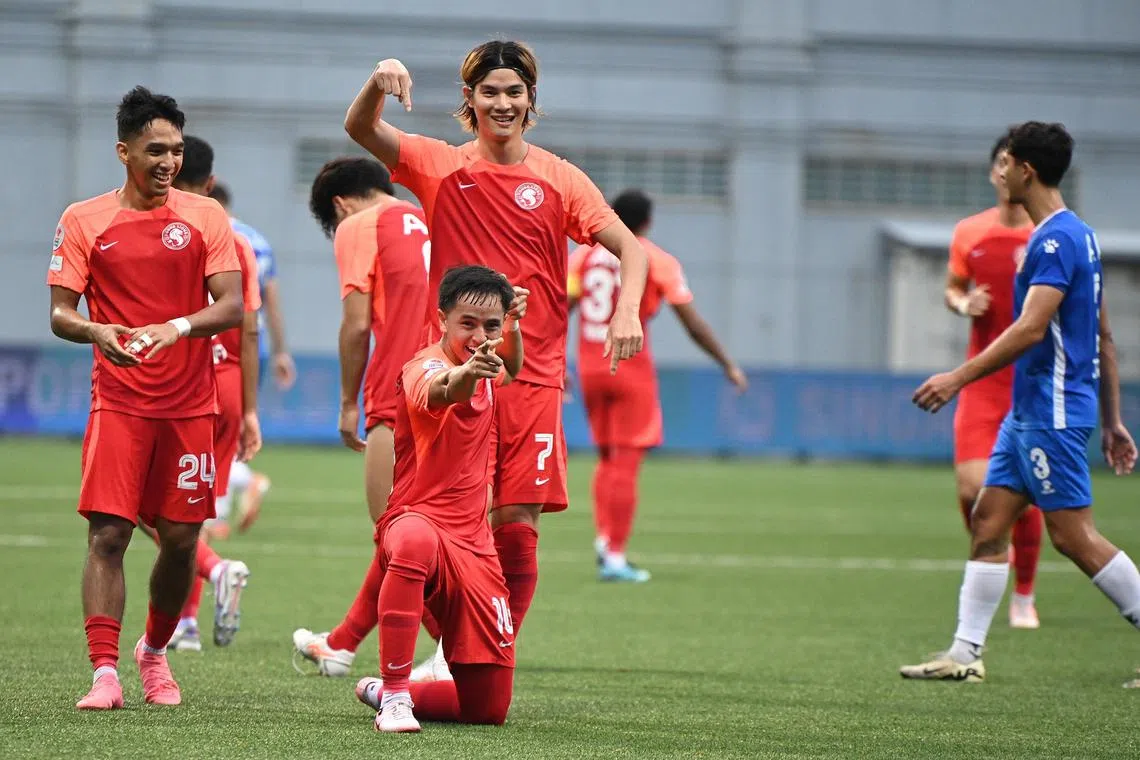 Goalscorers Kan Kobayashi (top) and Fathullah Rahmat celebrating a goal in the Young Lions' 4-4 draw with Hougang United.