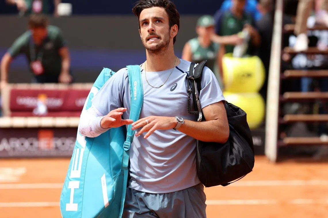 Tennis - Italian Open - Foro Italico, Rome, Italy - May 12, 2026 Italy's Lorenzo Musetti looks dejected after losing his round of 16 match against Norway's Casper Ruud REUTERS/Ciro De Luca