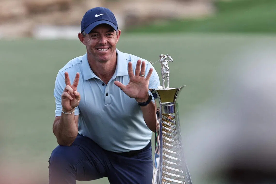 Northern Ireland's Rory McIlroy celebrates with his trophy at the end of the 2025 DP World Tour Championship.
