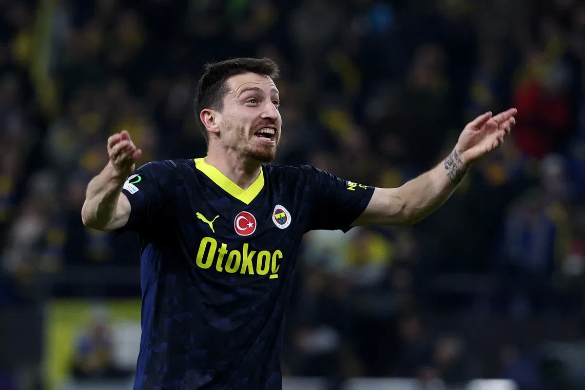 Soccer Football - Europa Conference League - Round of 16 - First Leg - Union Saint-Gilloise v Fenerbahce - Lotto Park, Anderlecht, Belgium - March 7, 2024 Fenerbahce's Mert Hakan Yandas celebrates after Dusan Tadic scores their third goal REUTERS/Yves Herman