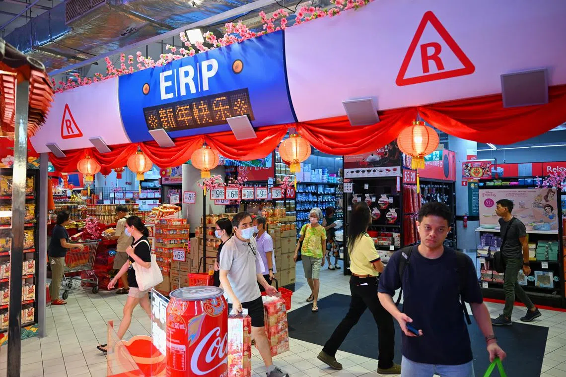 Standalone: FairPrice Xtra AMK Hub's Chinese New Year goods display has features showing MRT train and ERP gantry.

Shoppers can sit in a train cabin, wheel past an ERP gantry, and walk through street signages at the FairPrice Xtra AMK Hub supermarket. These are part of Chinese New Year decorations, and other decorations like a dragon made out of used canned drinks and an array of neon light signages.