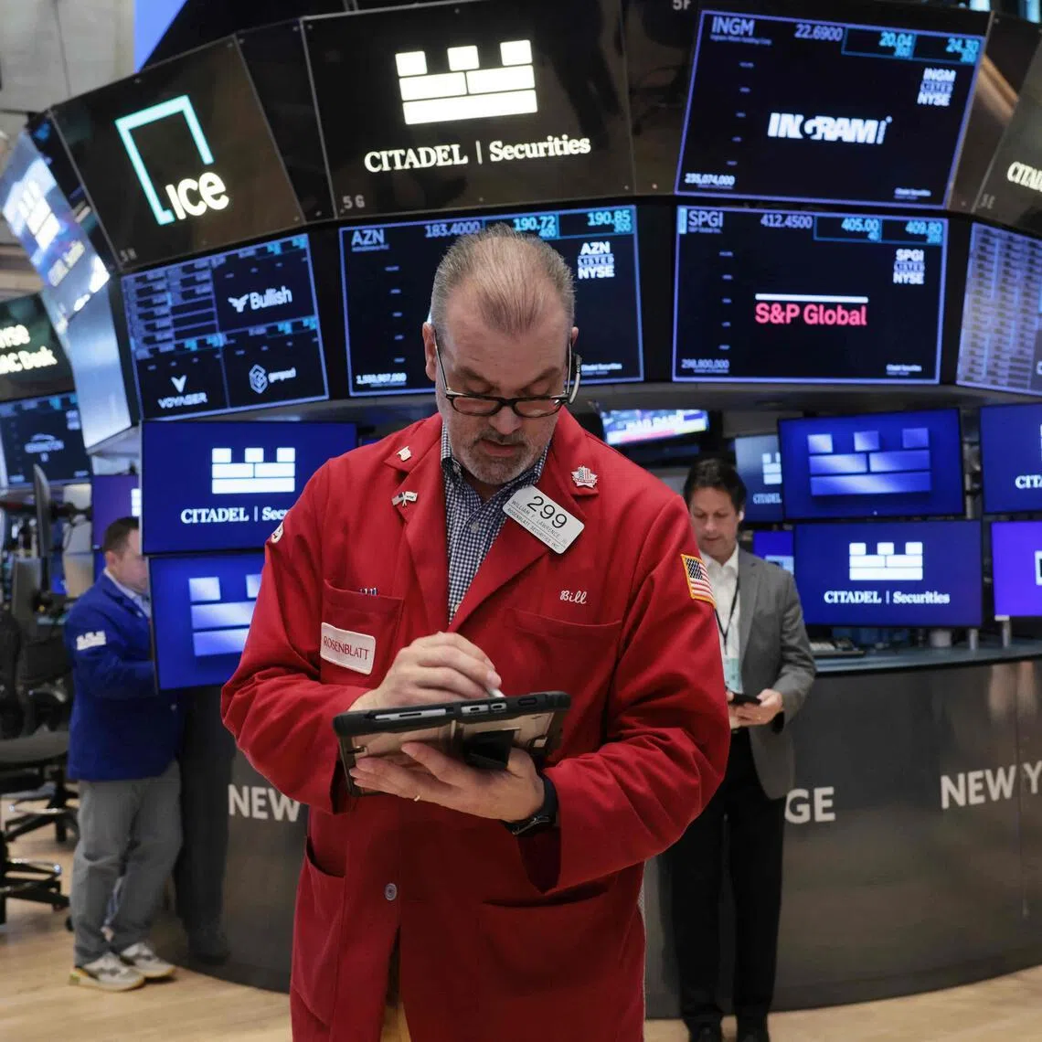 Traders working on the floor of the New York Stock Exchange on March 27, in New York City.