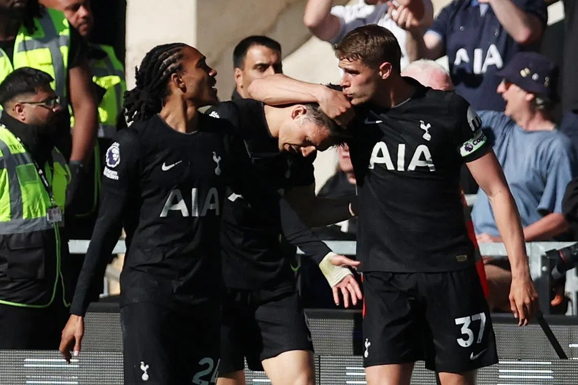 Soccer Football - Premier League - Wolverhampton Wanderers v Tottenham Hotspur - Molineux Stadium, Wolverhampton, Britain - April 25, 2026 Tottenham Hotspur's Joao Palhinha celebrates scoring their first goal with Micky van de Ven and Djed Spence REUTERS/Chris Radburn