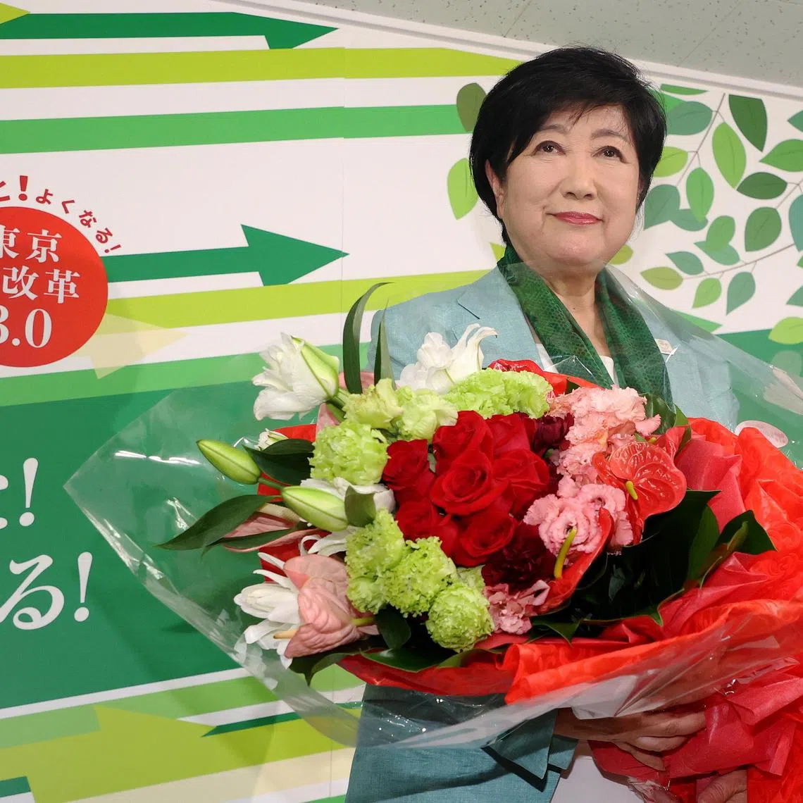 Tokyo Governor Yuriko Koike celebrates after winning the third straight term in Tokyo gubernatorial election on July 7.