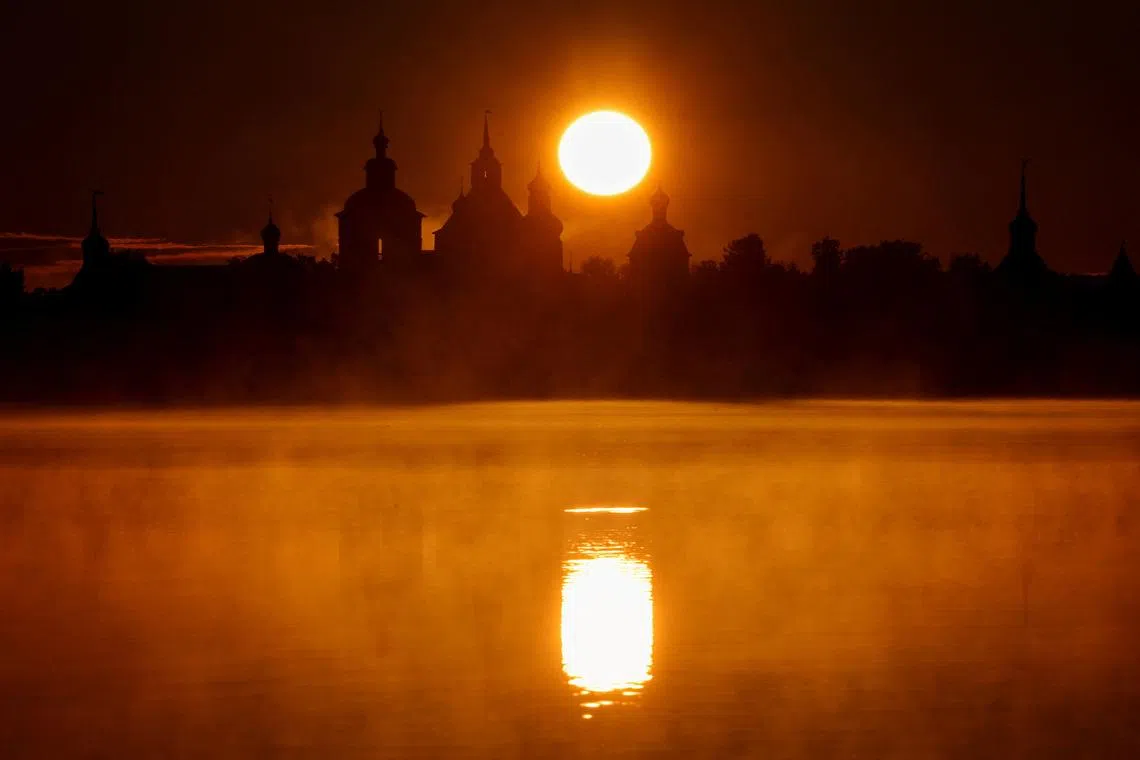 The sun rises behind the Kirillo-Belozersky Monastery on the shore of Lake Siverskoye in the Vologda region, Russia, June 28, 2026. REUTERS/Marina Lystseva TPX IMAGES OF THE DAY