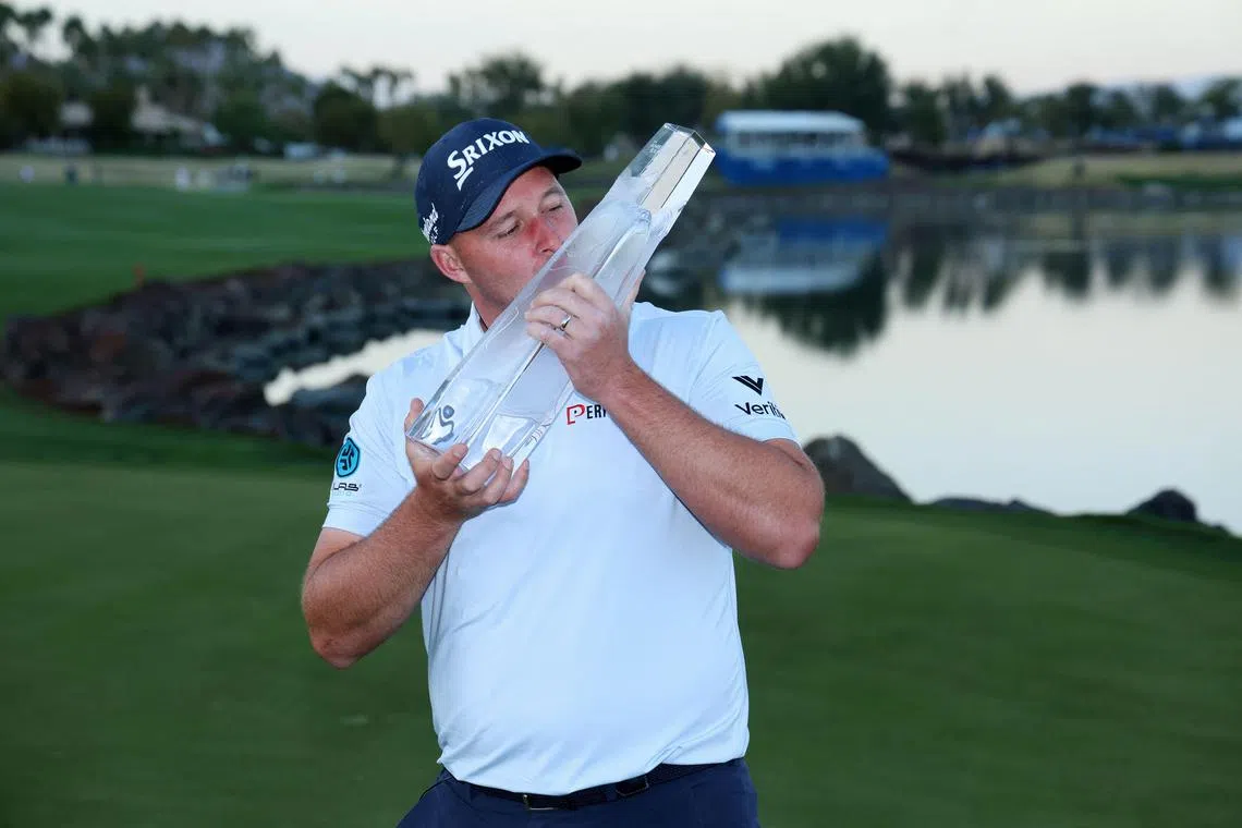 Sepp Straka of Austria posing with the trophy after putting in to win on the 18th green during the final round of The American Express 2025 at Pete Dye Stadium Course on Jan 19 in La Quinta, California.