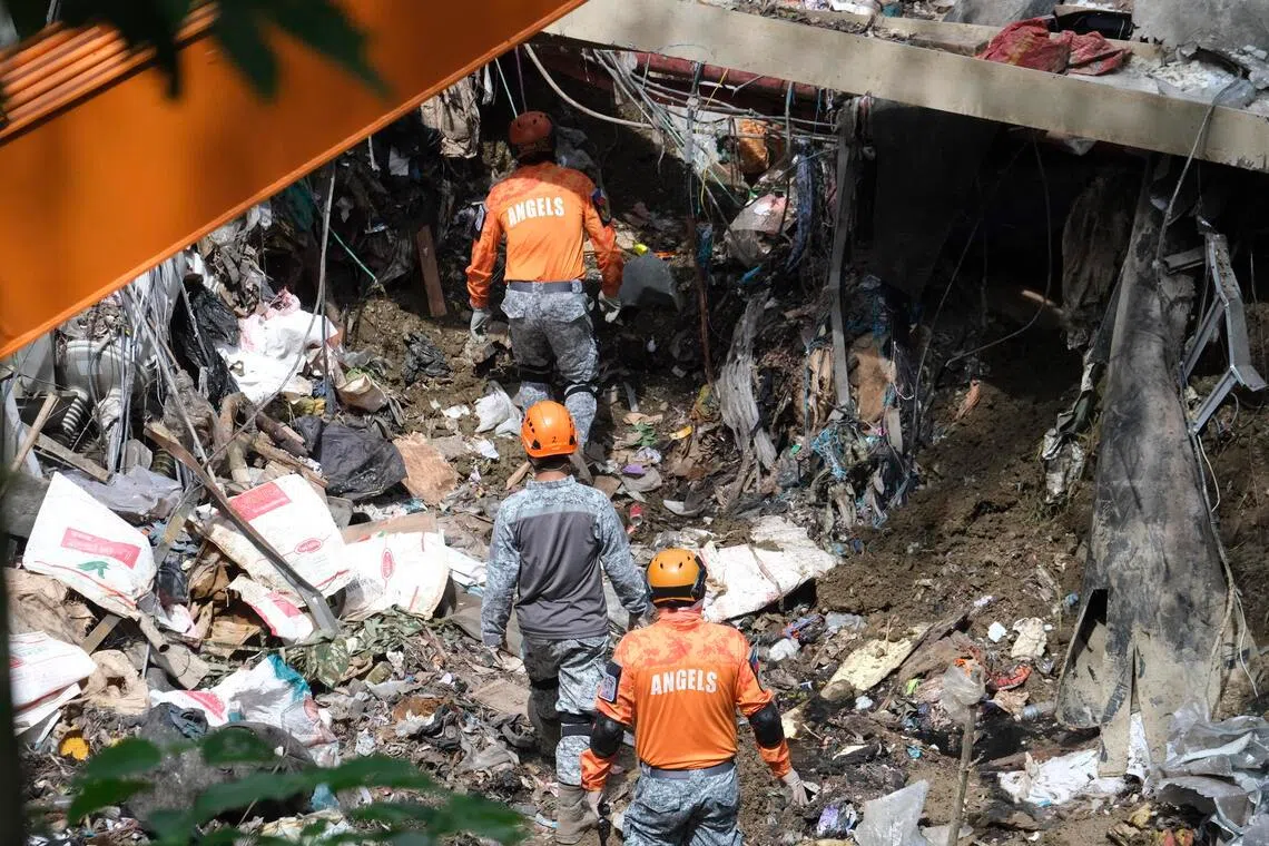 Emergency response personnel conduct search operations at the site of a collapse at a waste landfill in Binaliw village in Cebu City, central Philippines, on Jan 10, 2026.