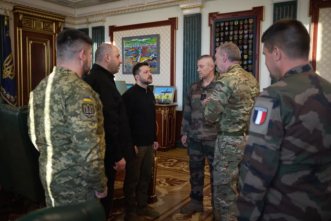 Ukrainian President Volodymyr Zelensky (third from left) meeting British and French military chiefs in Kyiv on April 5.