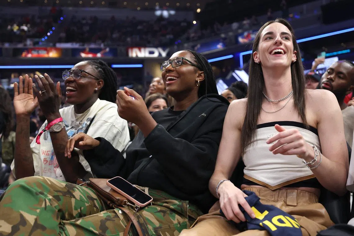 Aliyah Boston and Caitlin Clark of the Indiana Fever cheer prior to the Kia WNBA Skills Challenge during the 2025 AT&T WNBA All-Star weekend at Gainbridge Fieldhouse.